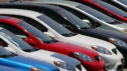 A row of Toyota sedans on a dealership lot. A row of Toyota sedans on a dealership lot.