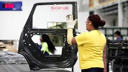 A worker assembles a door at the Fiat Chrysler plant in Warren, Michigan. A worker assembles a door at the Fiat Chrysler plant in Warren, Michigan.