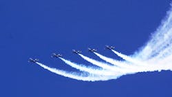 A group of Blue Angels flies in unison. A group of Blue Angels flies in unison.