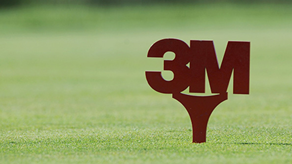 The 3M logo on a golf course