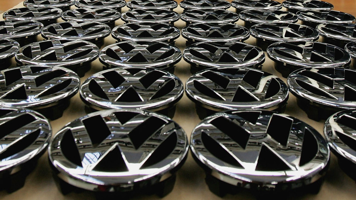 A tabletop of VW hood ornament logos.
