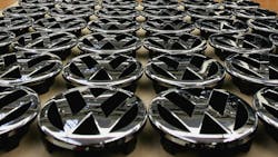 A tabletop of VW hood ornament logos. A tabletop of VW hood ornament logos.