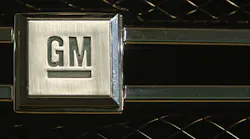 A GM logo on a car grille.