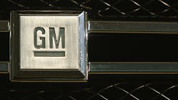 A GM logo on a car grille. A GM logo on a car grille.