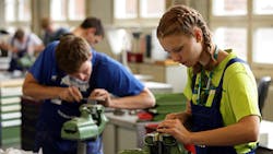 Young engineering students ply their craft and trade. Young engineering students ply their craft and trade.