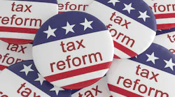 Pile of Tax Reform Buttons With US Flag