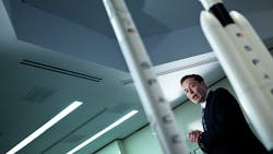 SpaceX CEO Elon Musk in front model rockets. SpaceX CEO Elon Musk in front model rockets.