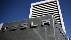 The front of a Tesla building. The front of a Tesla building.