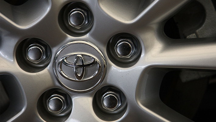 A Toyota logo on a wheel.