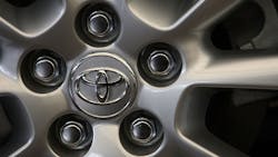 A Toyota logo on a wheel. A Toyota logo on a wheel.