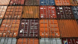 A wall of shipping containers. A wall of shipping containers.