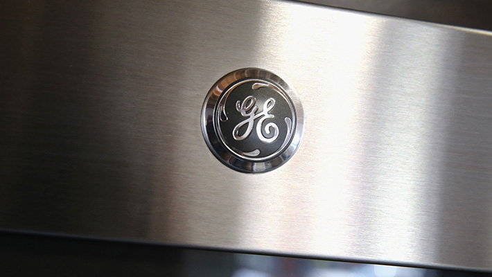 The GE logo on an appliance.