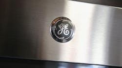 The GE logo on an appliance. The GE logo on an appliance.