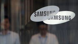 The Samsung logo and wordmark on doors at the company's headquarters. The Samsung logo and wordmark on doors at the company's headquarters.
