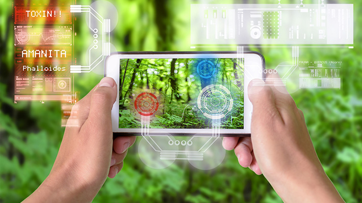 Two hands holding a smartphone overlaid with augmented reality graphics.