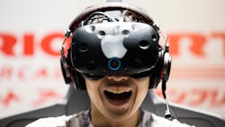 A man wears an HTC Vive with a superimposed Apple logo on it. A man wears an HTC Vive with a superimposed Apple logo on it.