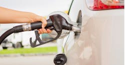 Pumping gas into car Pumping gas into car