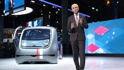VW CEO Matthias Mueller on stage with the company's new Cedric autonomous car. VW CEO Matthias Mueller on stage with the company's new Cedric autonomous car.