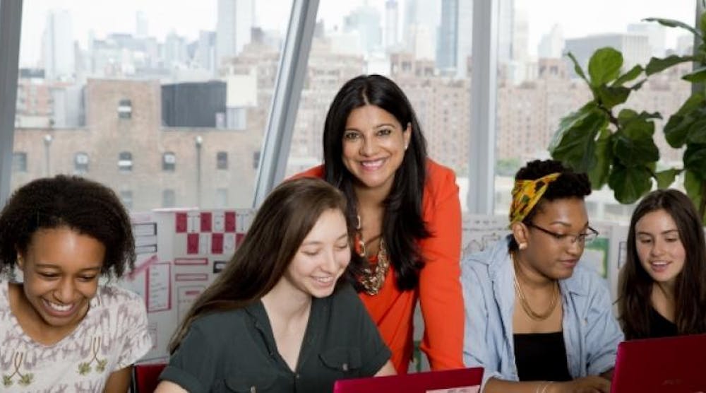 Girls Who Code founder Reshma Saujani center with some of the young women in the club.
