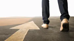Man walking past forward arrow