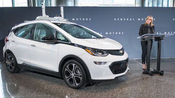 GM CEO Mary Barra with an autonomous Chevy Bolt in December 2016