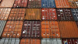 A wall of shipping containers. A wall of shipping containers.
