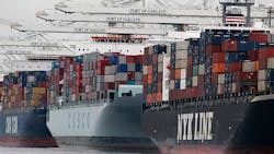 A fleet of container ships stand in the Port of Oakland. A fleet of container ships stand in the Port of Oakland.