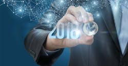 Hand holding crystal globe with 2018 Hand holding crystal globe with 2018