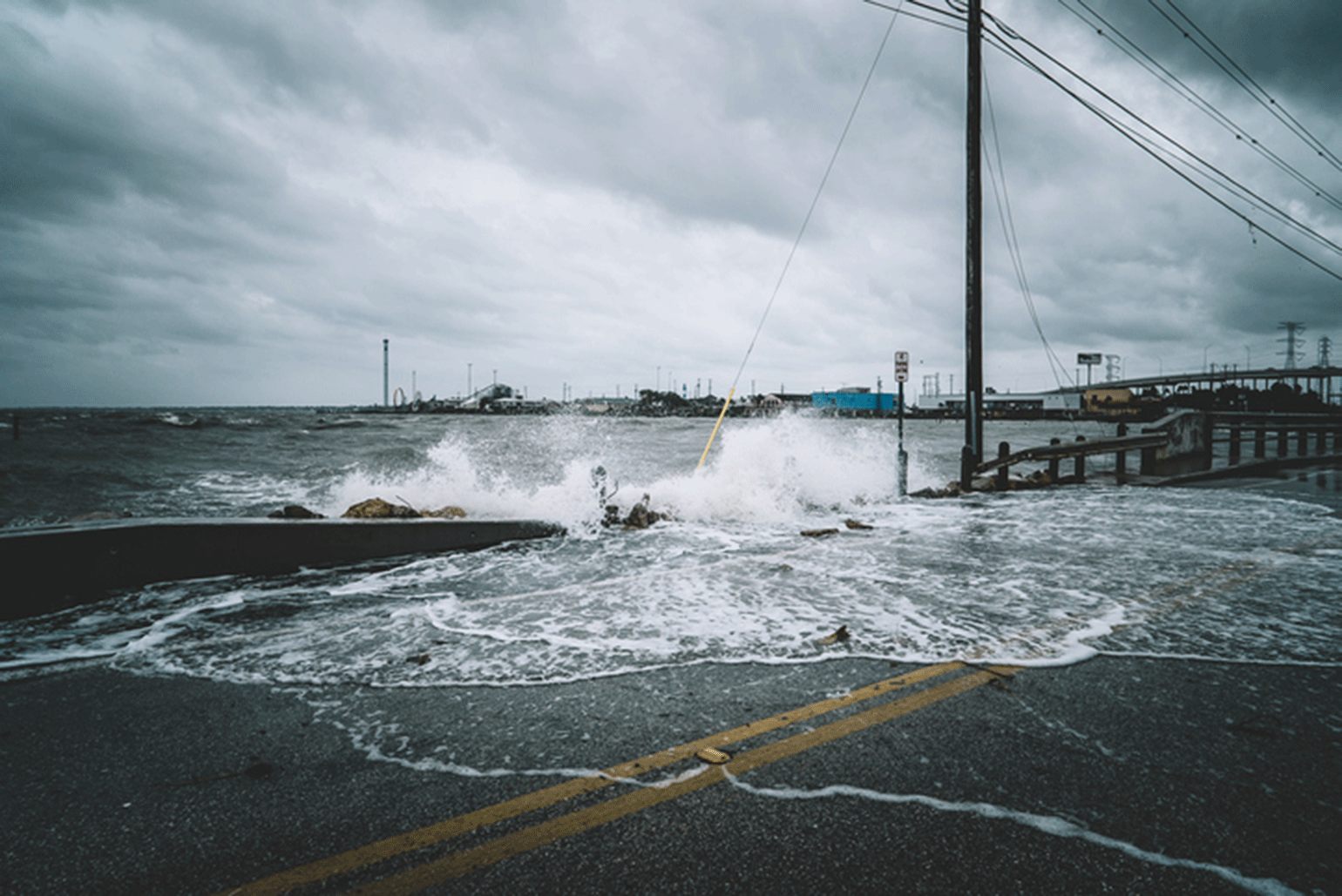 Hurricane washing water over road