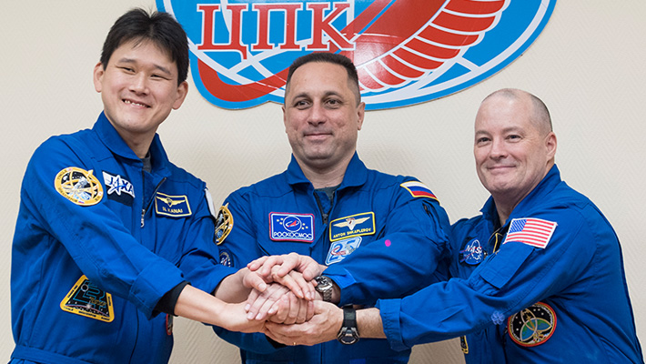Norishige Kanai of JAXA, Anton Shkaplerov of Roscosmos, and Scott Tingle of NASA.