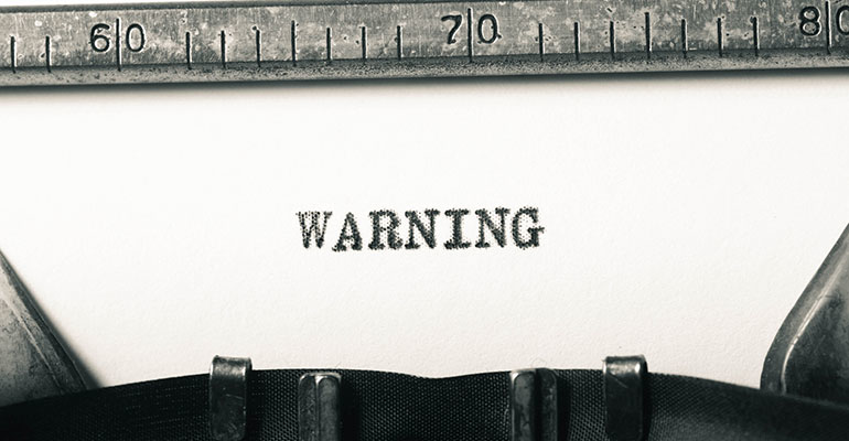 warning on a typewriter