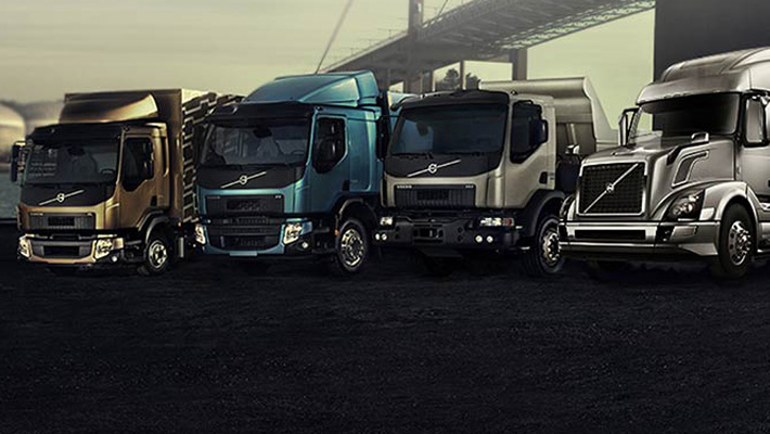 A row of Volvo semi trucks.