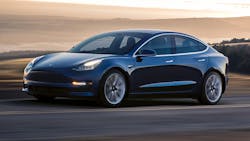 The Tesla Model 3 in a company photo. The Tesla Model 3 in a company photo.