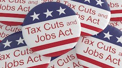 A pile of buttons trumpeting the Tax Cuts and Jobs Act. A pile of buttons trumpeting the Tax Cuts and Jobs Act.
