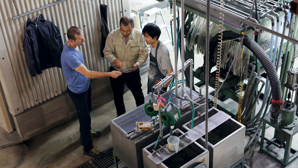 3 men examining something