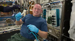 NASA astronaut Barry Wilmore holds a ratchet 3D printed by Made In Space aboard the International Space Station