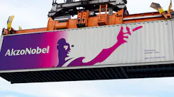 The Akzo Nobel logo and wordmark advertise the company from the side of a shipping container.