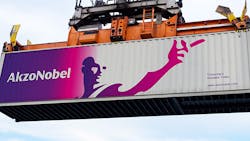 The Akzo Nobel logo and wordmark advertise the company from the side of a shipping container. The Akzo Nobel logo and wordmark advertise the company from the side of a shipping container.