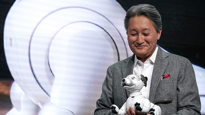 Sony CEO Kazuo Hirai hold the company's new aibo robot at CES 2018 in Las Vegas.