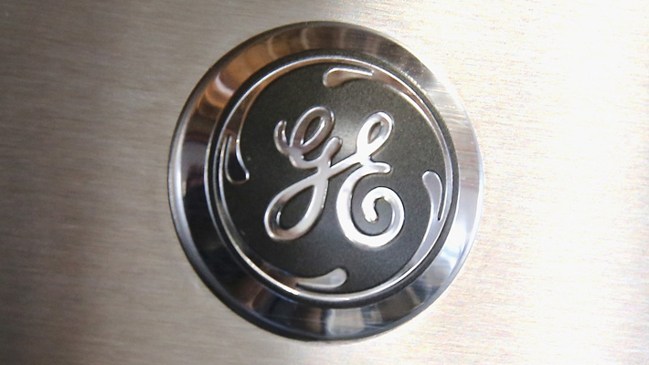 The GE logo appears on the front of a home appliance.