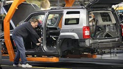 A worker builds a Jeep Compass at the Fiat Chrysler plant in Belvidere, Illinois. A worker builds a Jeep Compass at the Fiat Chrysler plant in Belvidere, Illinois.