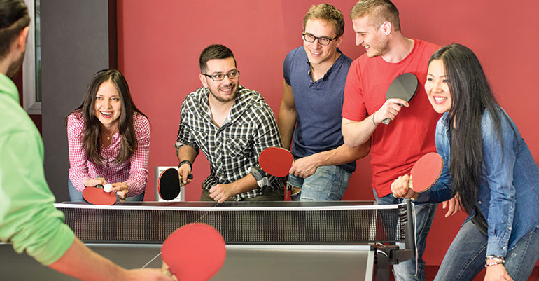 millennials playing ping pong