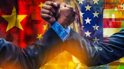 arm wrestling businessmen in front of US and China flags
