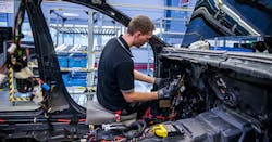 guy working on Mercedes at Germany factory guy working on Mercedes at Germany factory
