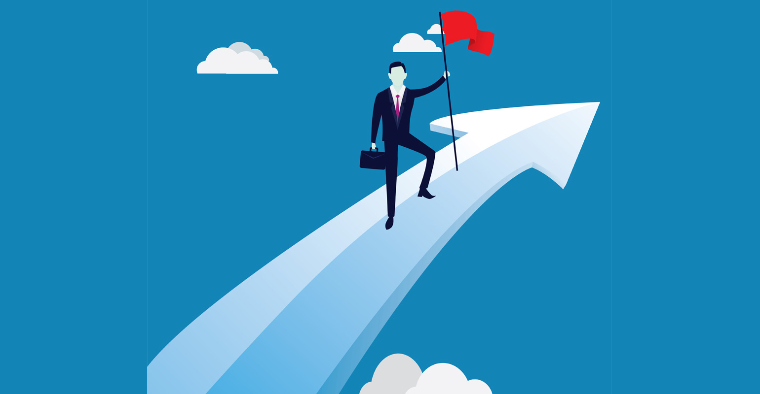 Businessman plants flag on upward arrow