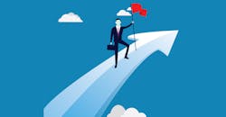 Businessman plants flag on upward arrow Businessman plants flag on upward arrow