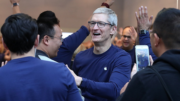 Apple CEO Tim Cook celebrates the release of the iPhone X during its November 2017 launch at the Palo Alto Apple store.