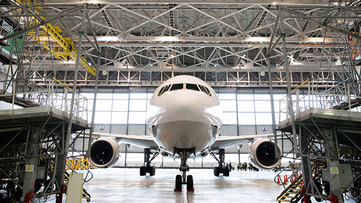 A Boeing 777 airliner at rest in a hangar in Tokyo.