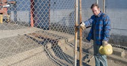 worker-left-behind-fence worker-left-behind-fence