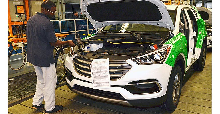 Alabama Hyundai employee works on Santa Fe